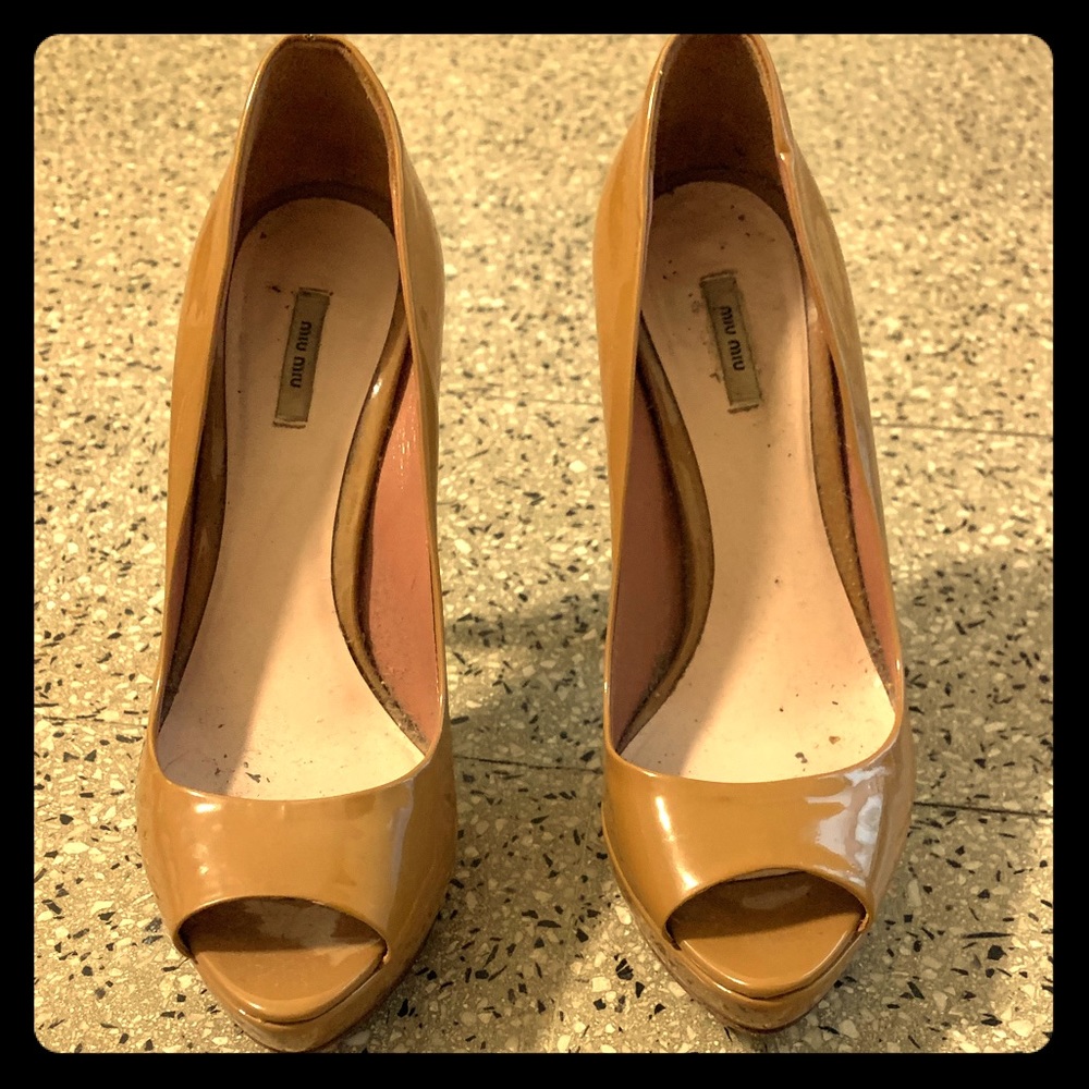 Miu Miu nude patent heels.